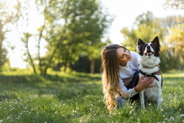 female dog owner in yard